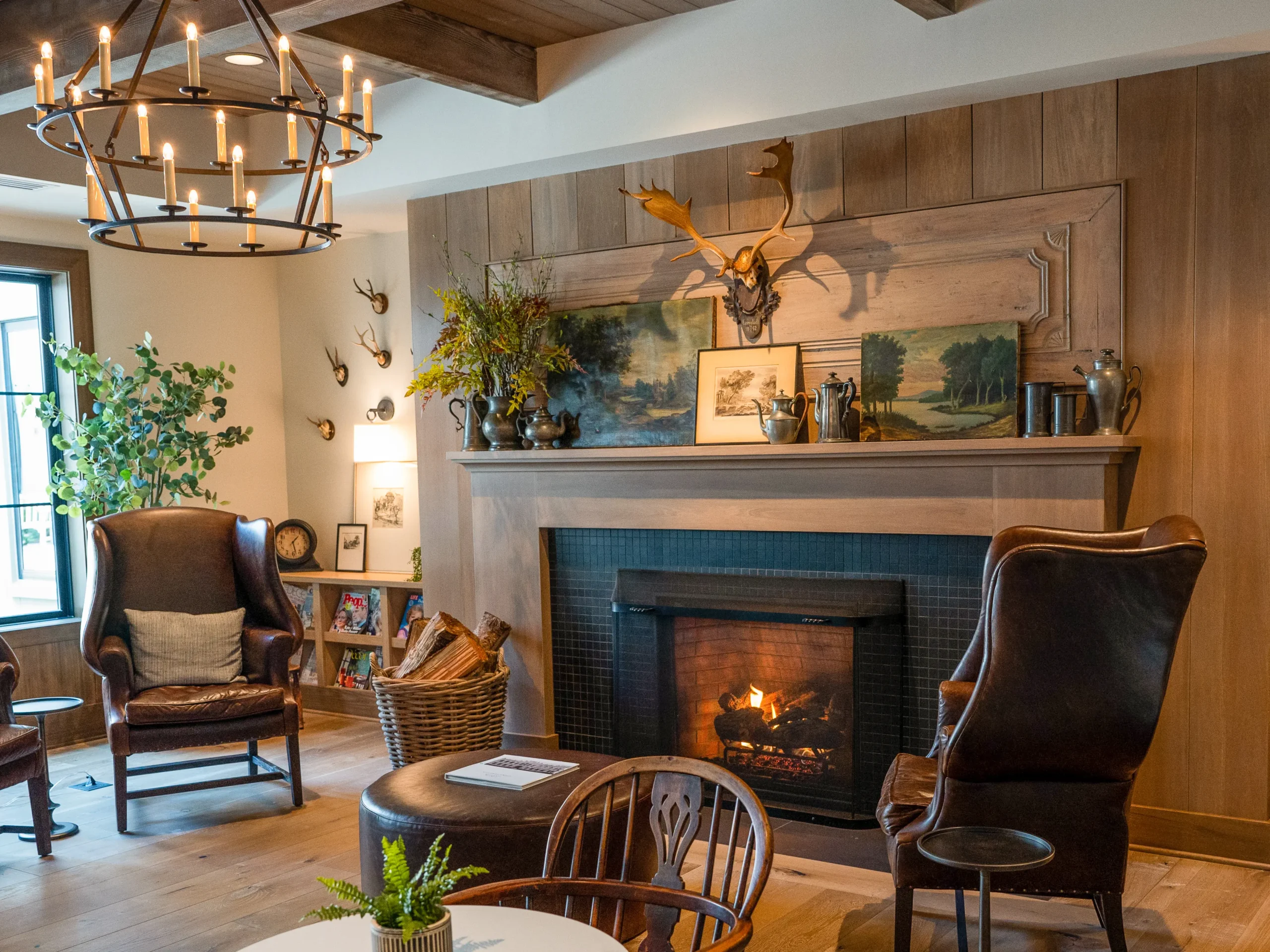 common area with chairs and fireplace