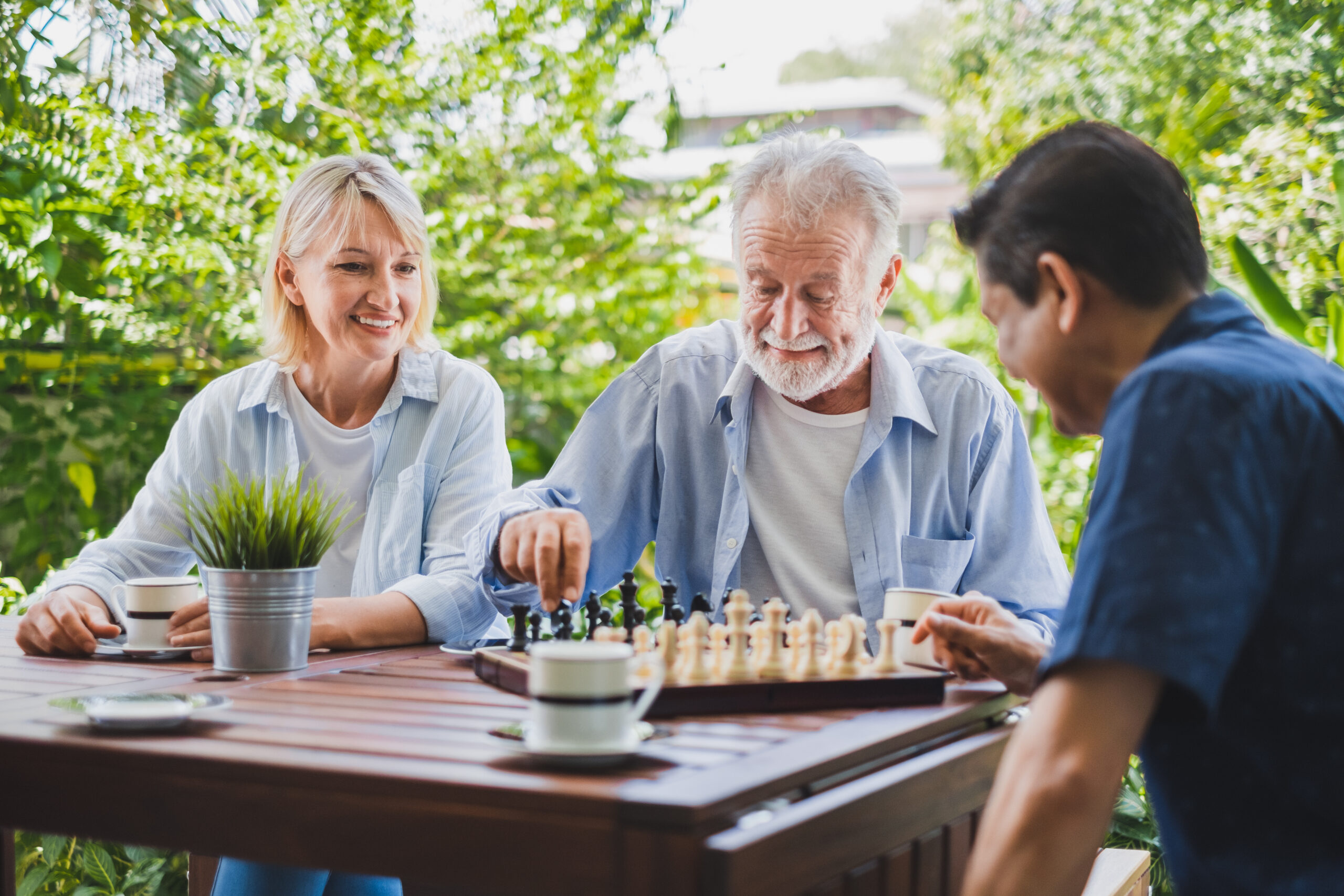 A patient with dementia engages in a game of chess to keep the mind active.