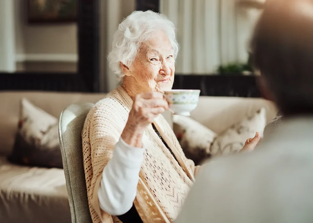 cute eldelry woman drinking tea